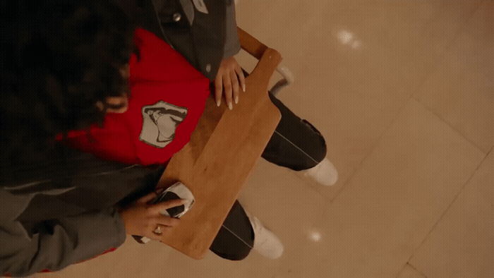 a person sitting at a table with a laptop