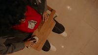 a person sitting at a table with a laptop