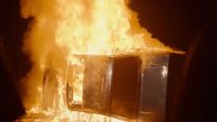 a fire is raging out of a building