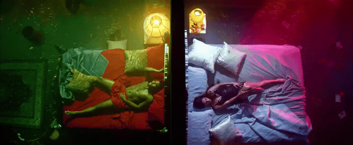 a person laying on a bed in a room