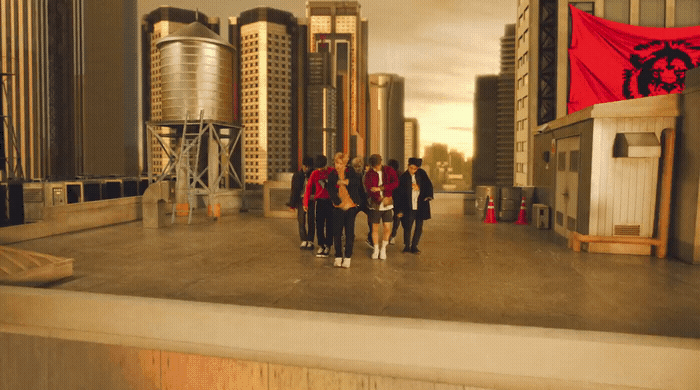 a group of people standing on top of a roof