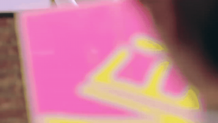 a blurry photo of a person holding a shopping bag