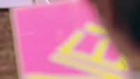 a blurry photo of a person holding a shopping bag