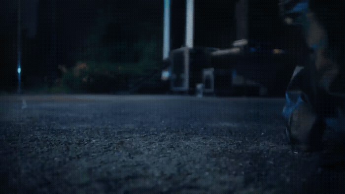 a blurry photo of a person sitting on the ground