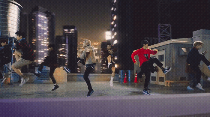 a group of people jumping in the air