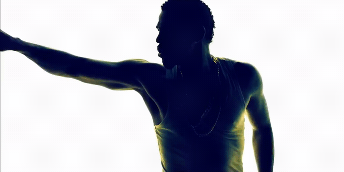 a silhouette of a man holding a tennis racquet