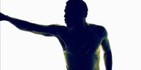 a silhouette of a man holding a tennis racquet