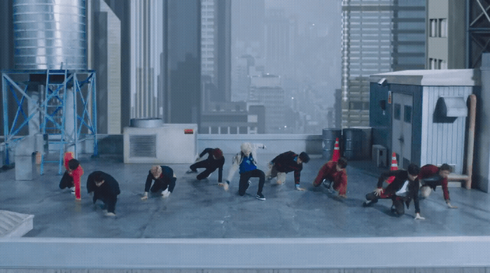 a group of people standing on top of a roof