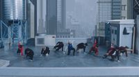 a group of people standing on top of a roof
