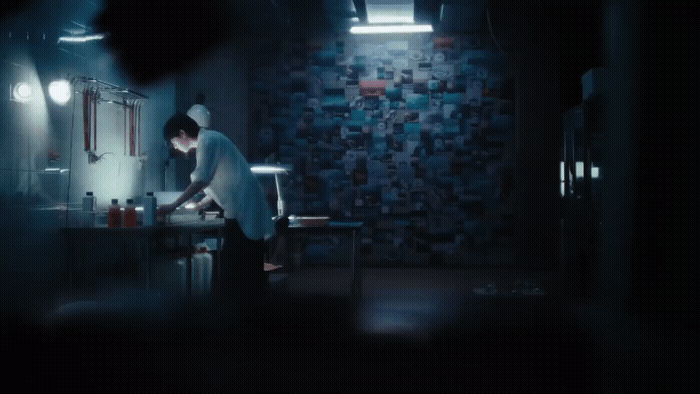 a man is standing in a dark room
