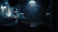 a man is standing in a dark room