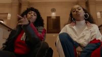 a couple of women sitting next to each other
