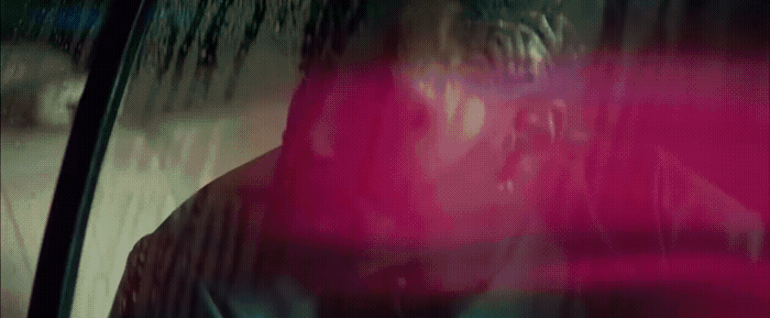 a blurry image of a person sitting in a car