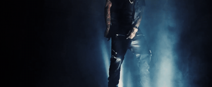 a man standing in the middle of a dark room