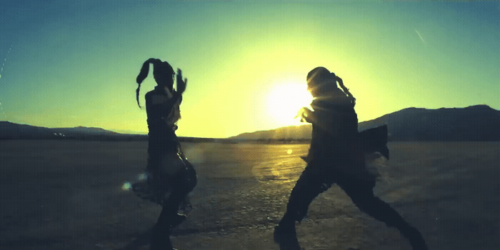 a couple of people that are standing in the dirt