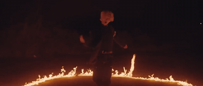 a man standing in a circle of fire