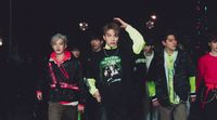 a group of young men standing next to each other