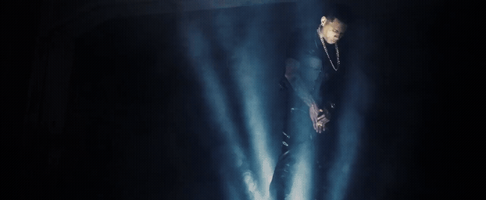 a man standing in the middle of a stage