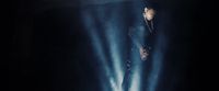 a man standing in the middle of a stage