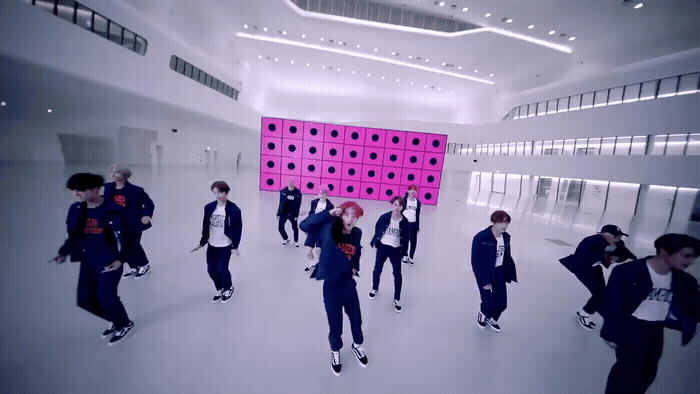 a group of people standing in a room