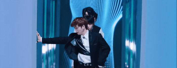 a couple of men standing next to each other