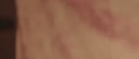 a blurry image of a person's hand holding a cell phone
