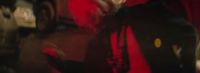 a blurry photo of a man in a red shirt
