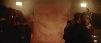 a group of people standing in a room