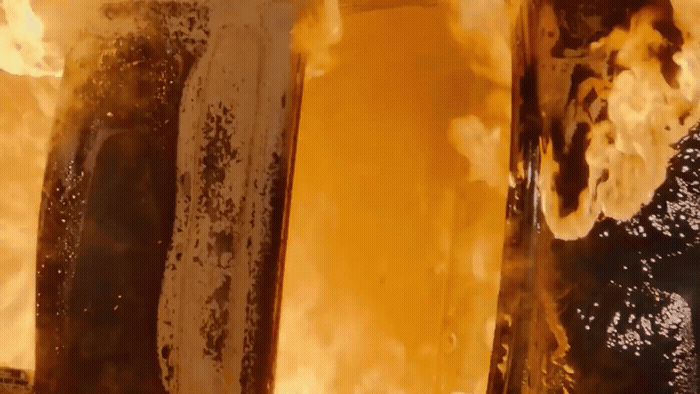 a close up of two hot dogs in a pan