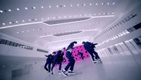 a group of young men riding skateboards in a building