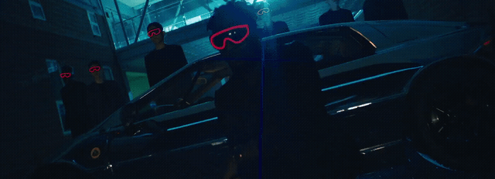 a person standing next to a car in the dark