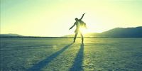 a person standing in the middle of a desert
