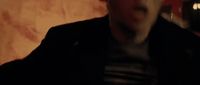 a blurry image of a man in a dark room