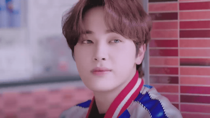 a young man with a scarf around his neck