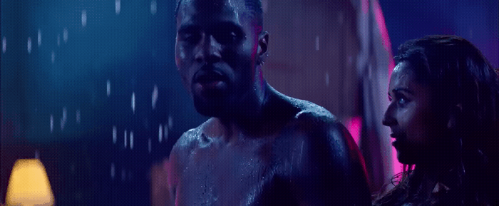 a man and a woman standing in the rain