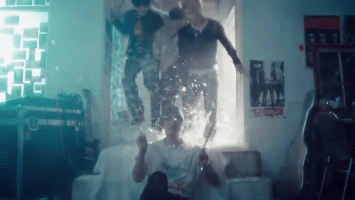 a group of young men standing on top of each other