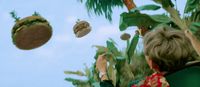 a woman flying a hamburger through the air