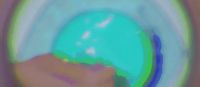 a blurry image of a person holding a green object