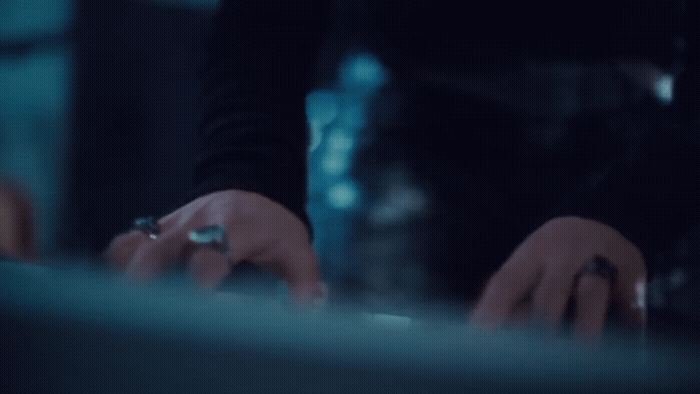 a close up of a person typing on a keyboard