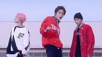 a group of young men standing next to each other