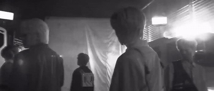 a group of people standing in a room