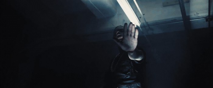 a person holding their hands up in the air