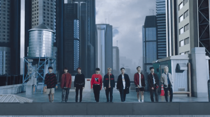 a group of young men walking down a city street