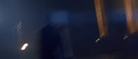 a blurry image of a person in a dark room