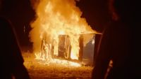 a fire blazing in the middle of a field