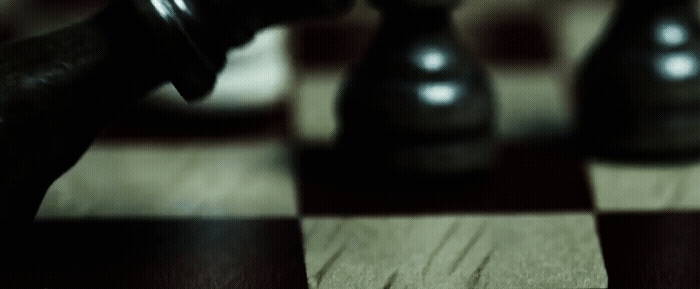 a close up of a chess board with a pawn