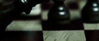 a close up of a chess board with a pawn