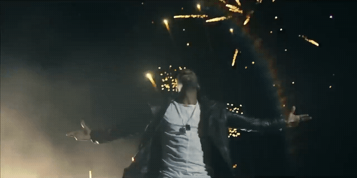 a man standing in front of a firework display
