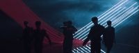 a group of people that are standing in the dark