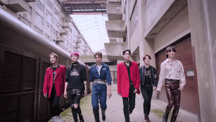 a group of young men walking down a street